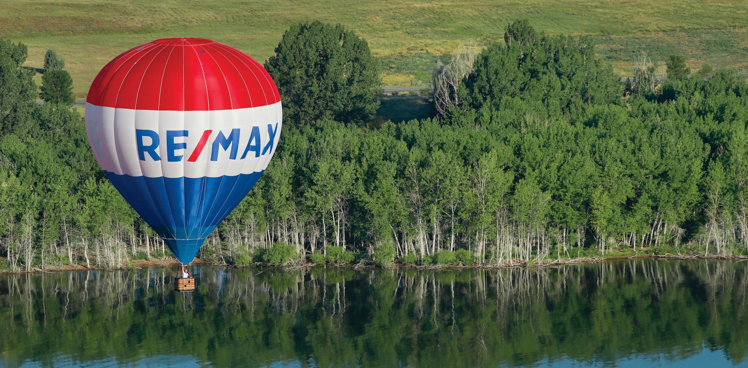 RE/MAX Hot Air Balloon over a lake