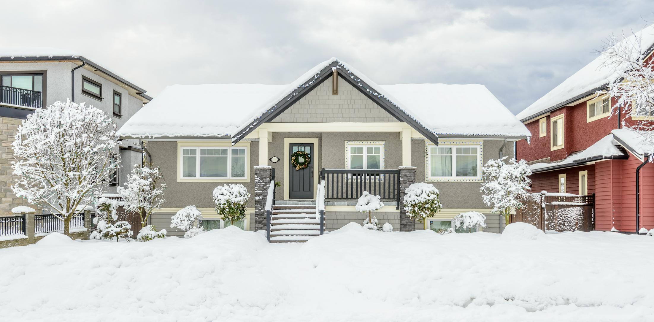 Grey house on a snowy day