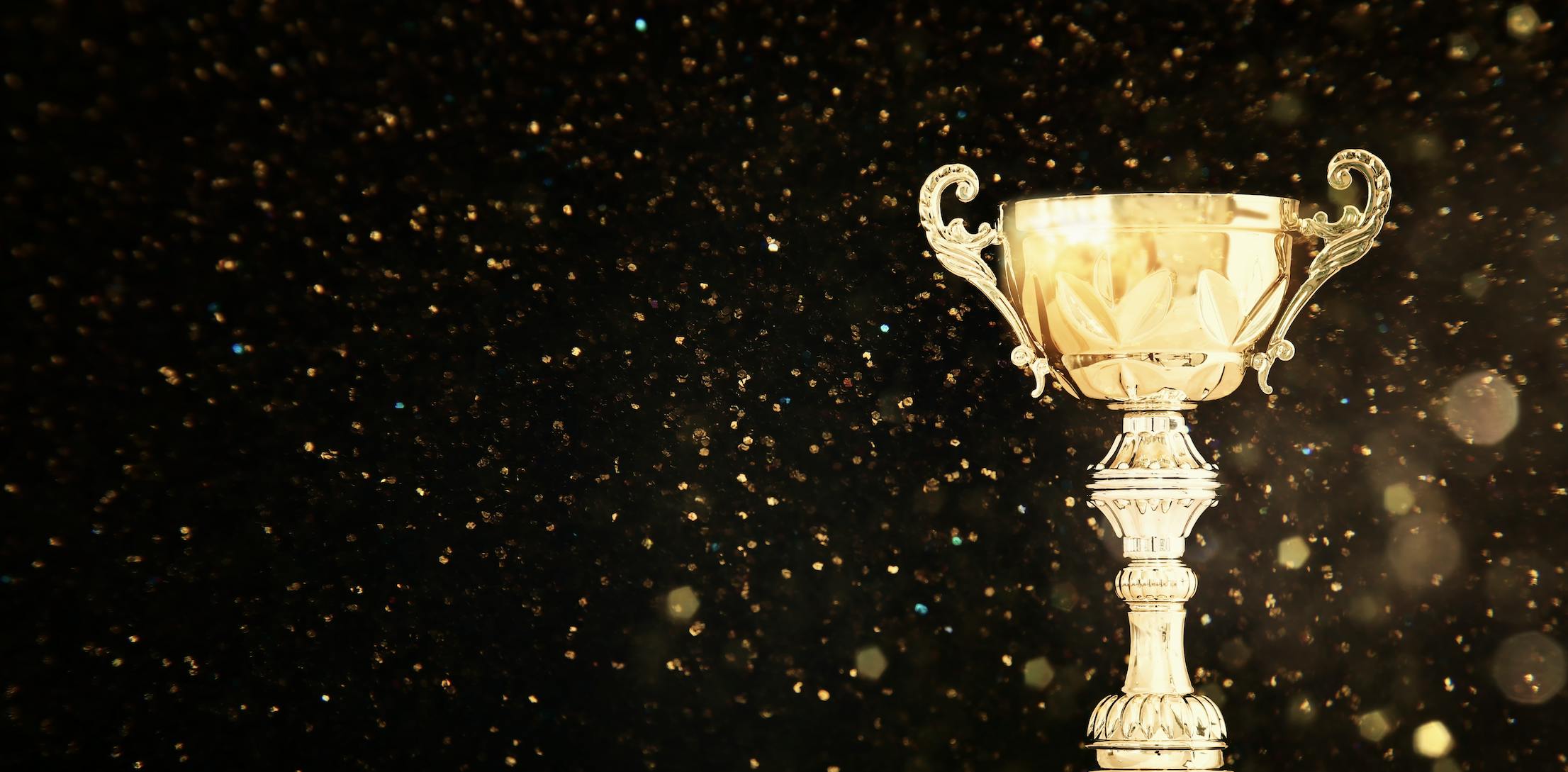 Gold trophy with black background