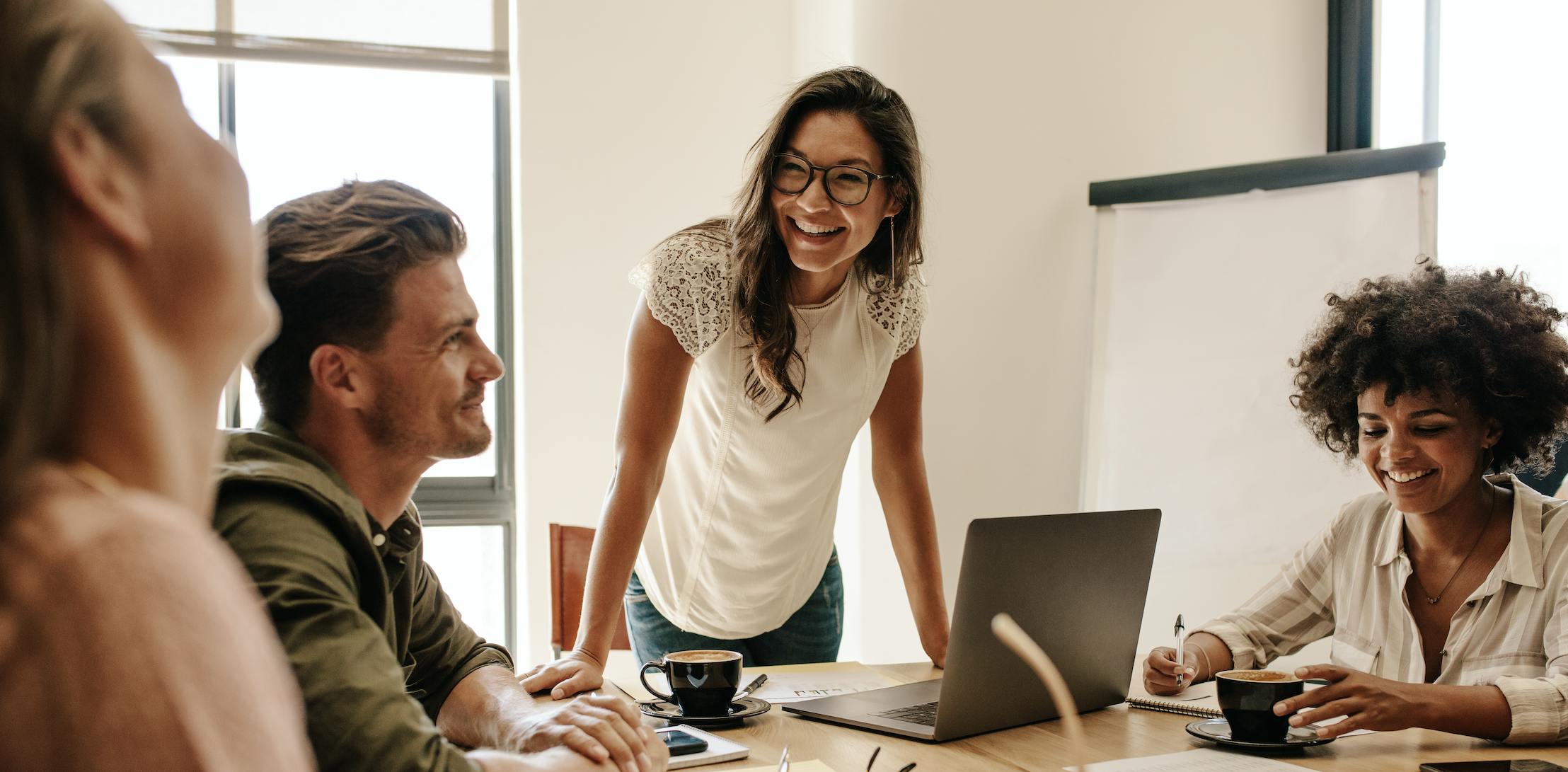 Businesswoman leading meeting in office