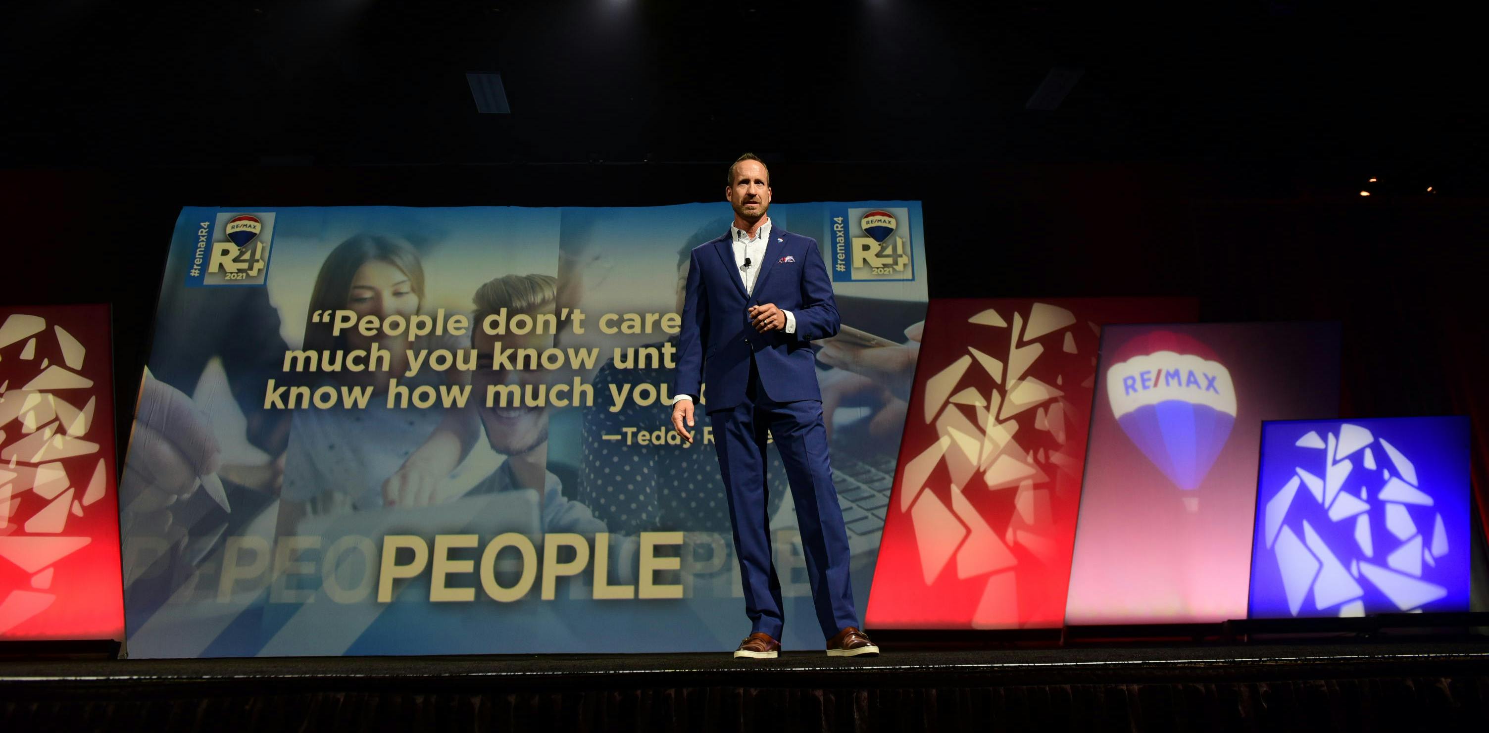 RE/MAX CEO Adam Contos on stage at 2021 RE/MAX R4