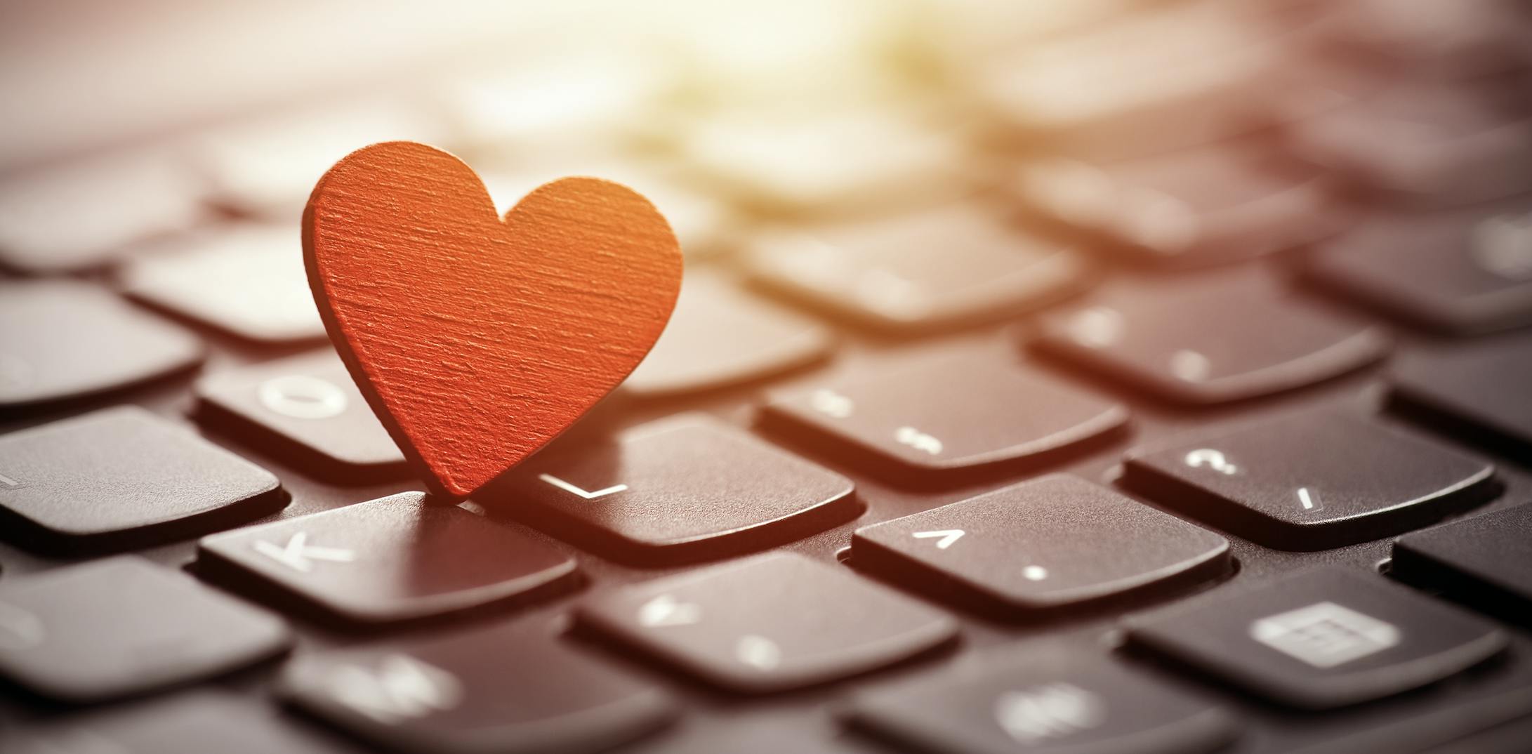 Red heart sitting on keyboard