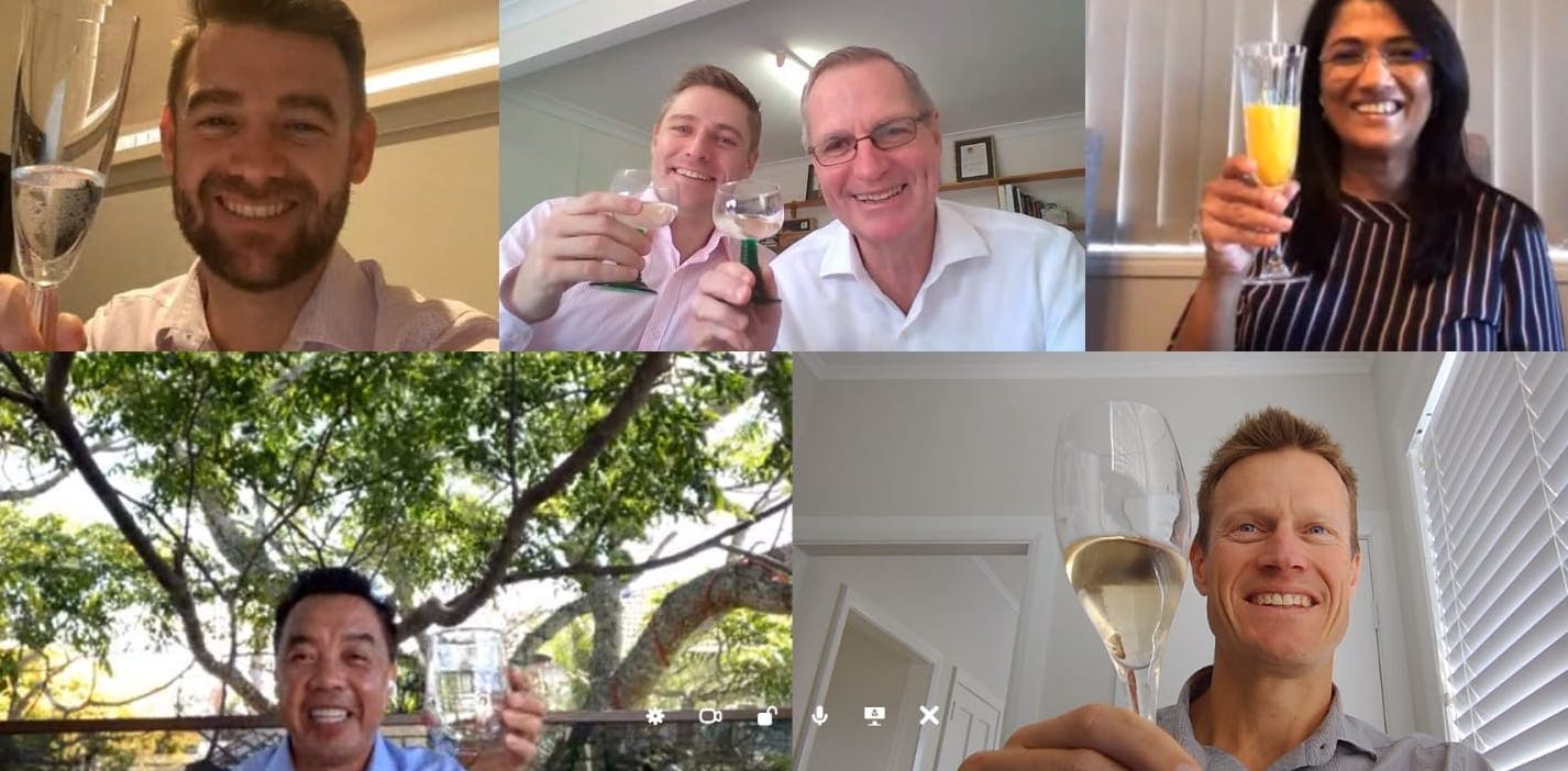RE/MAX New Zealand members raises glasses to cheers the sale