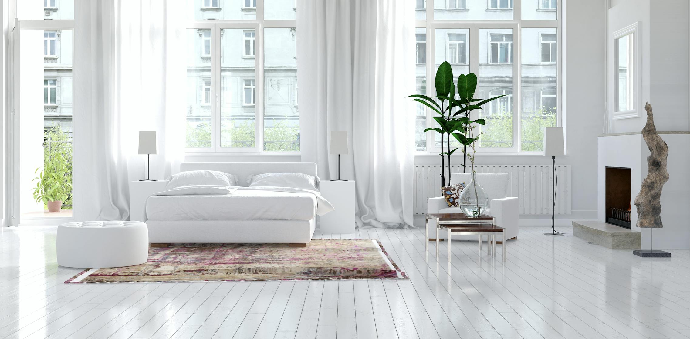 Living room with white floors and white walls.