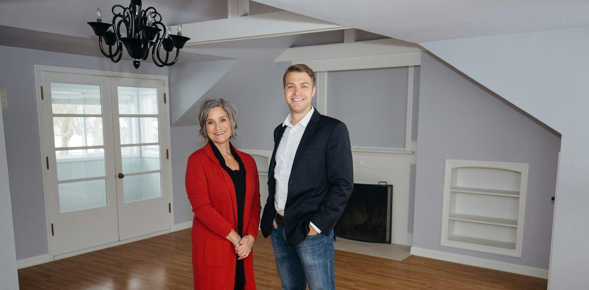 BethAnn Long stands in an empty living room with her son Riley