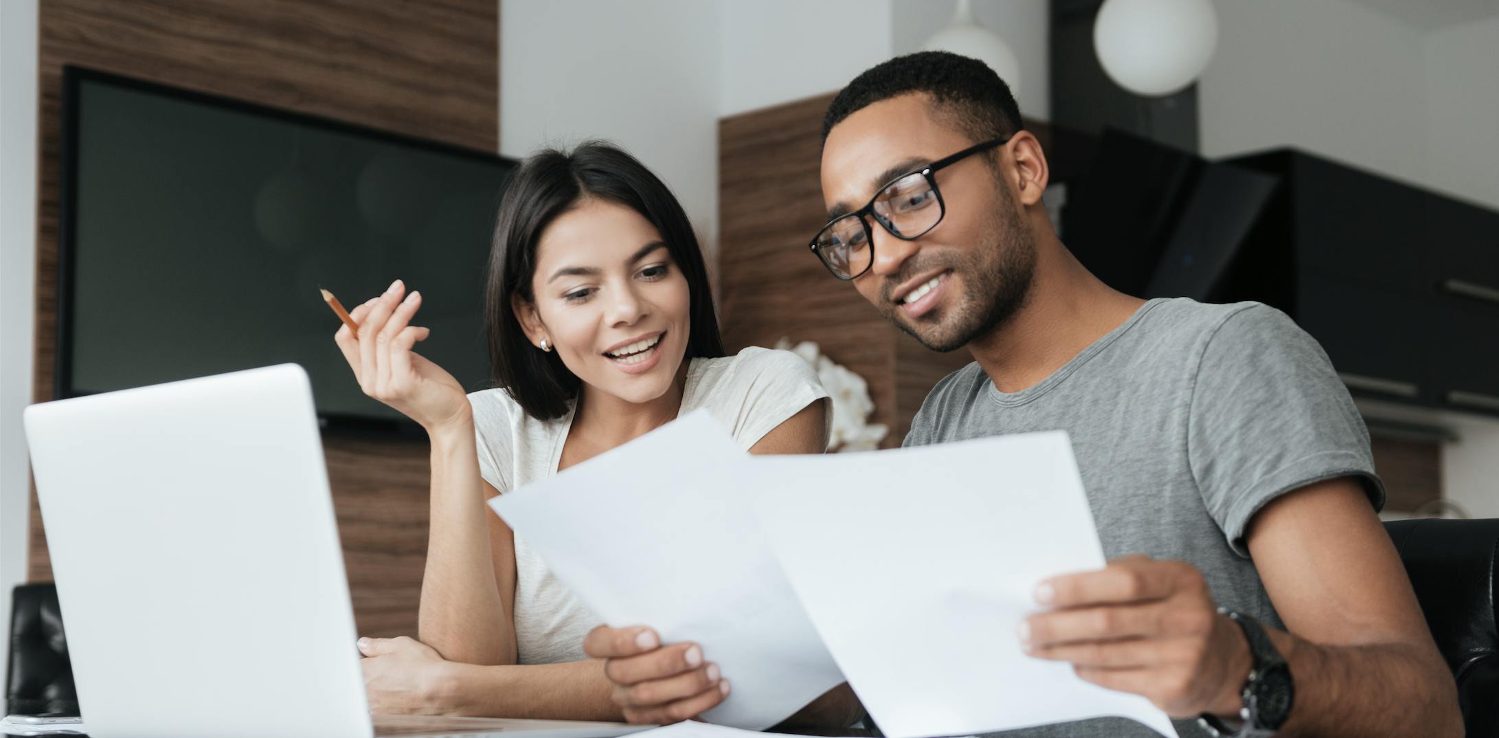 Two people reading through a document.