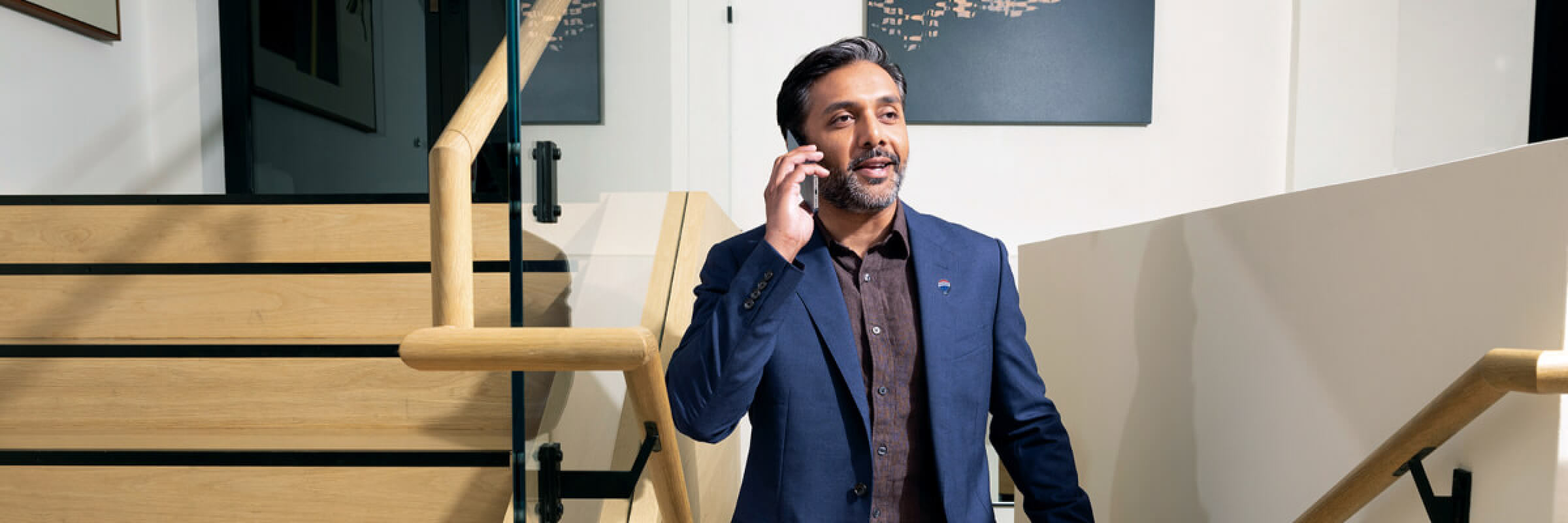 join-ca-blog-need-help-building your-empire-feat man talking on phone