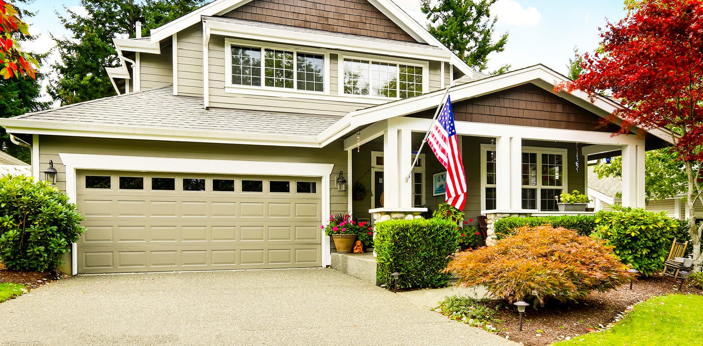 American flag flying outside of a house