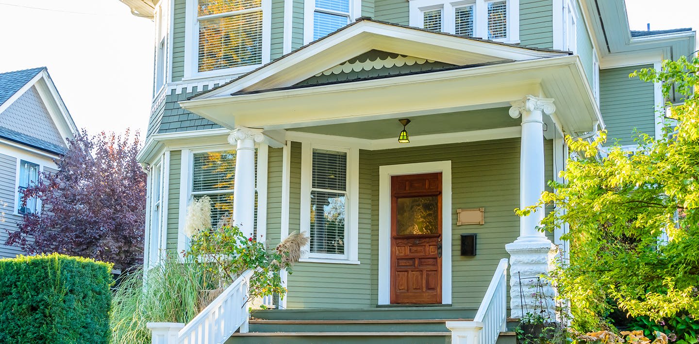 Green home with porch