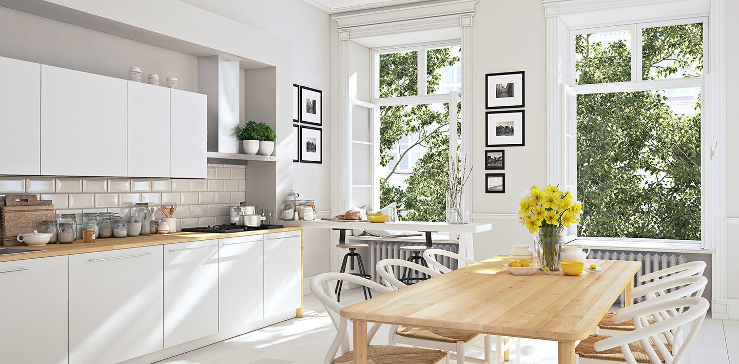 White kitchen with yellow flowers on the table