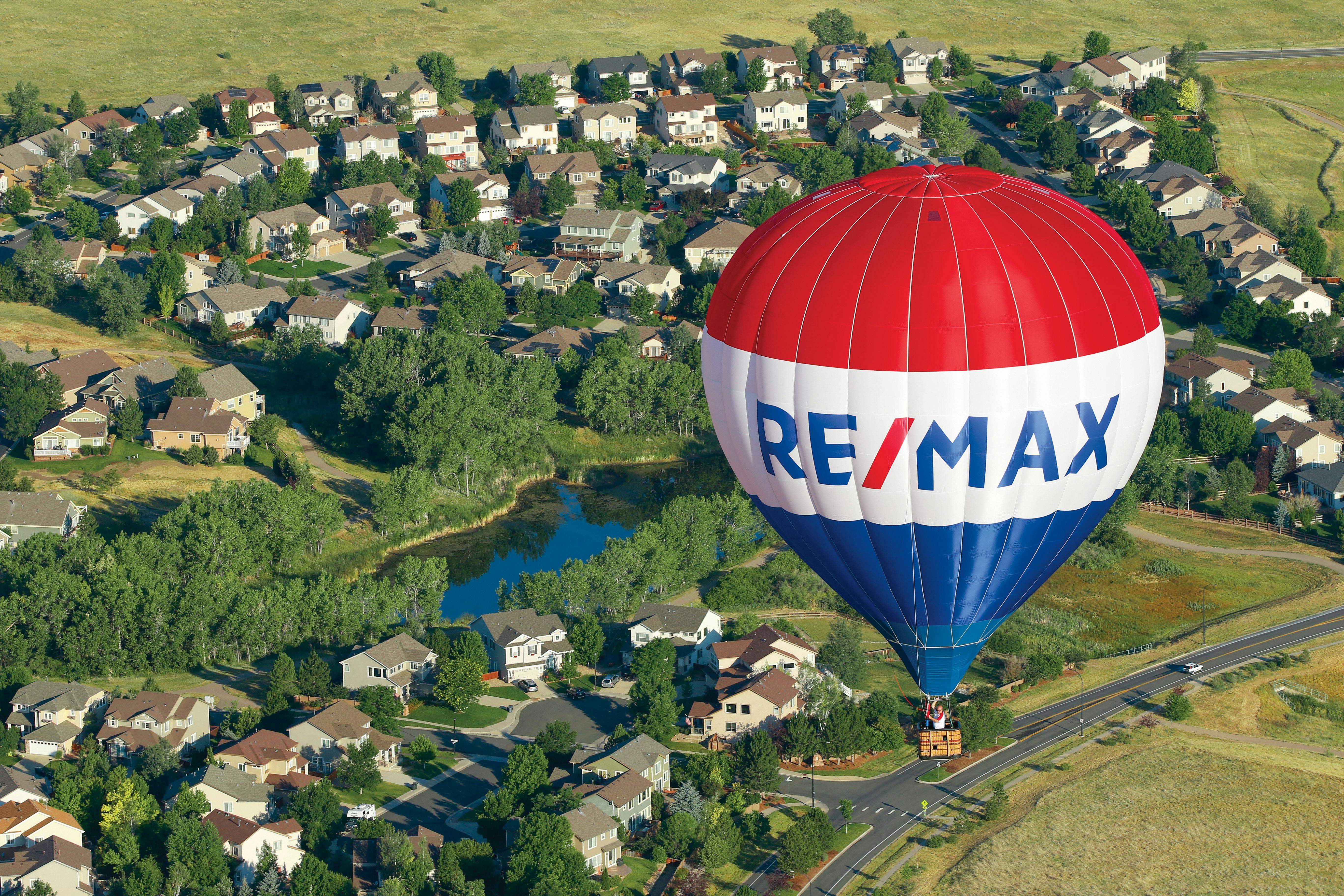 RE/MAX Hot Air Balloon over neighborhood
