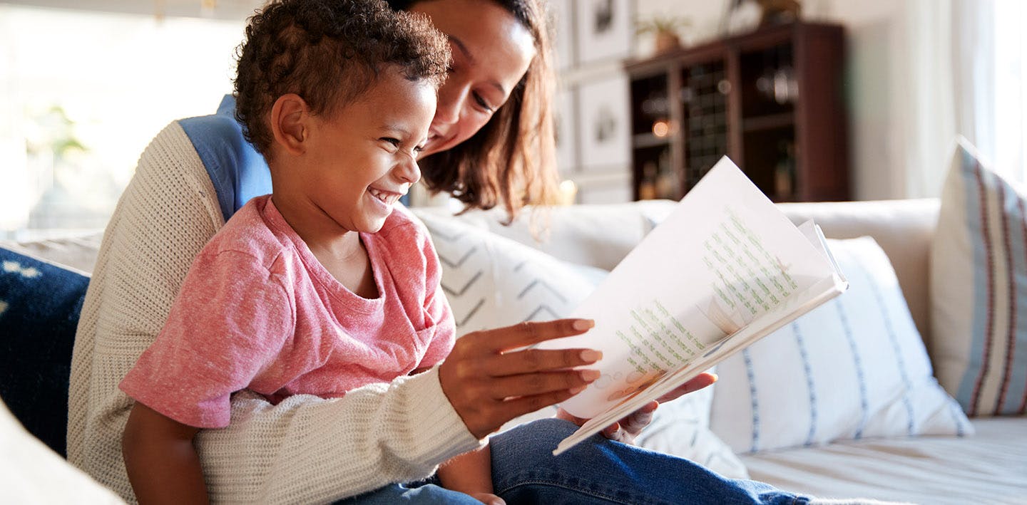 Child reading with mom