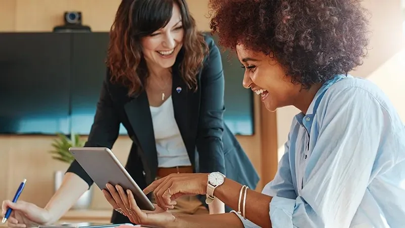 2women women together with tablet