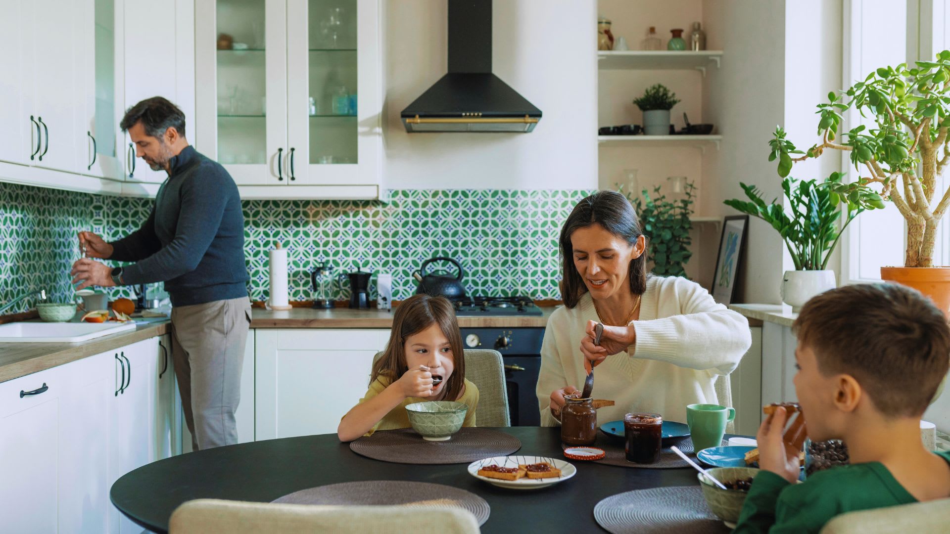Family in their kitchen having breakfast