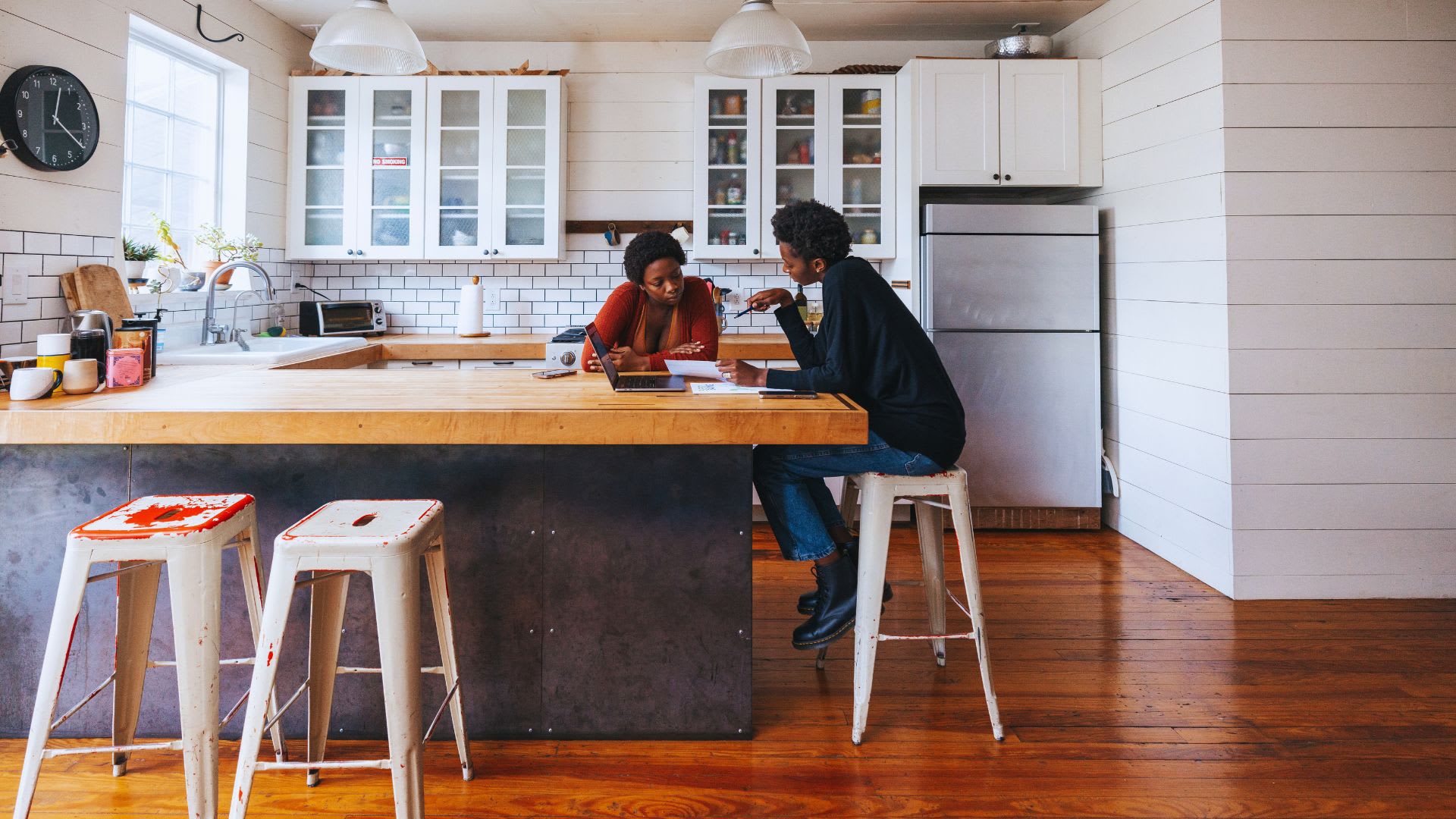 Woman Explaining Why Your Fixed Mortgage Rate Can Still Go Up To Her Friend
