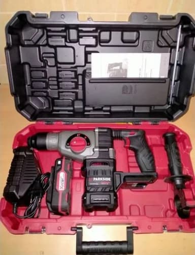 A red tool box with tools inside of it