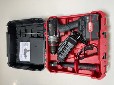 A red tool box with tools inside of it