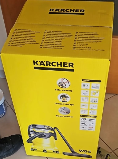A karcher vacuum sitting on a tiled floor
