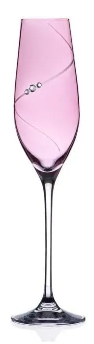 A wine glass with a pink liquid inside of it