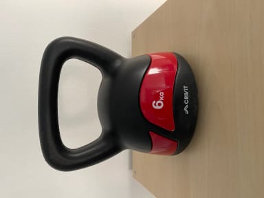 A close up of a red and black object on a wall