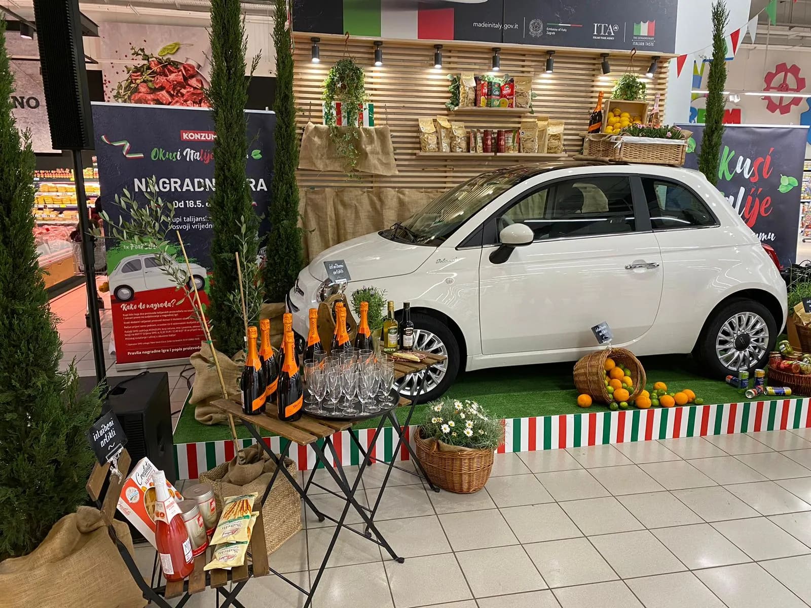 A small white car parked in a store