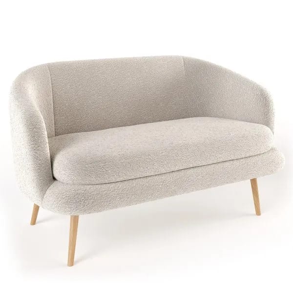 A gray chair with wooden legs and a white background