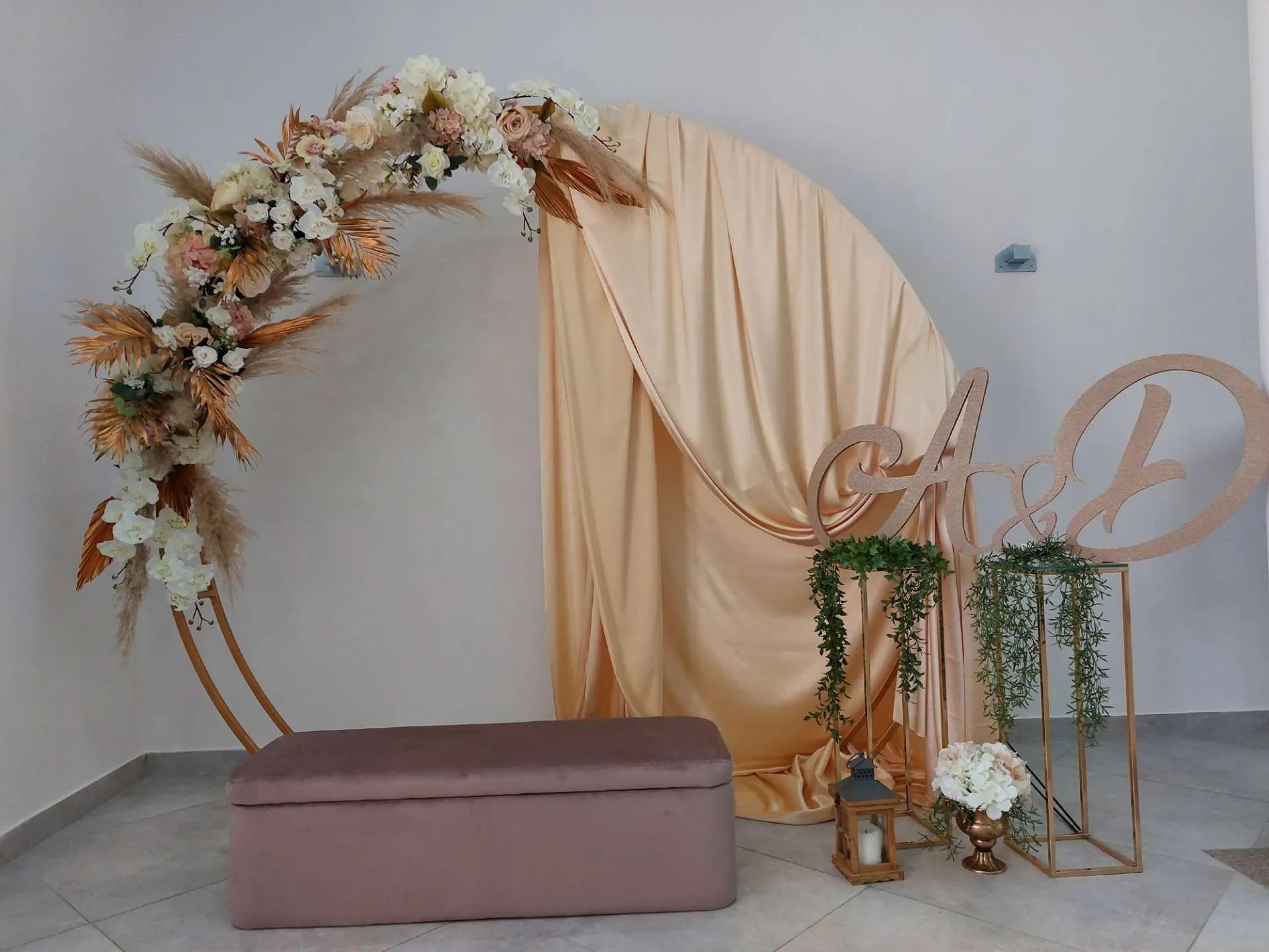 A wedding arch decorated with flowers and greenery
