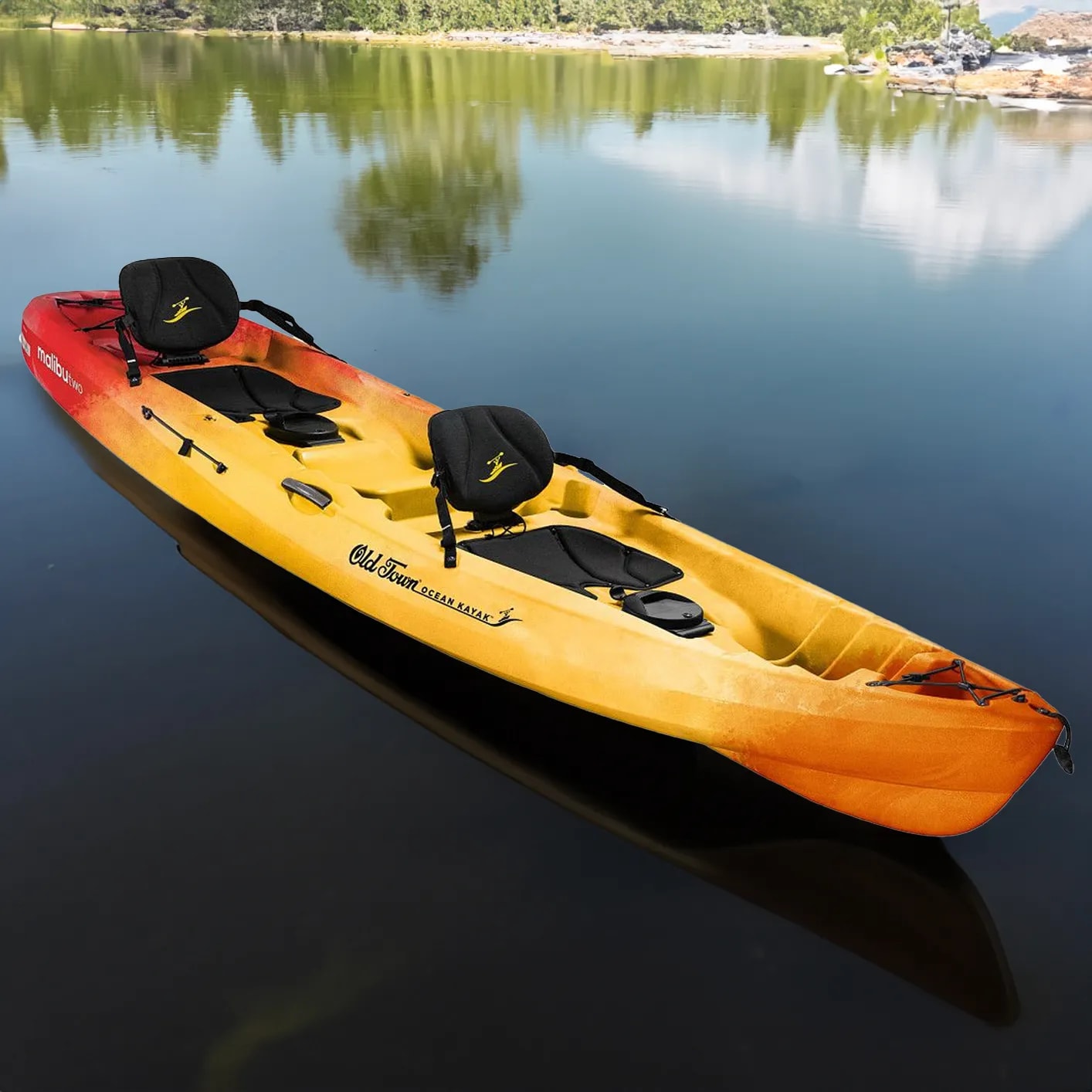 A yellow and red kayak floating on top of a lake