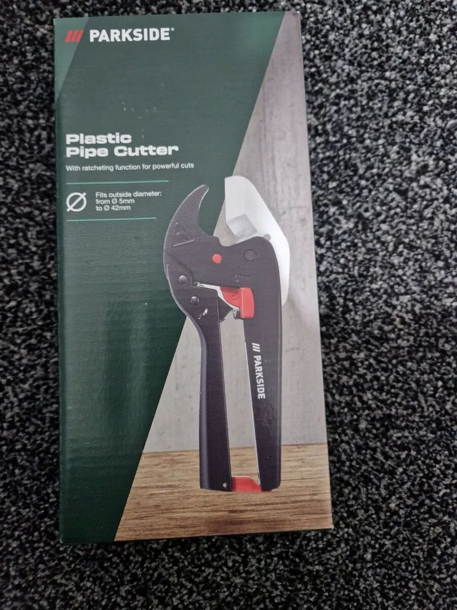 A pair of pliers sitting on top of a carpet
