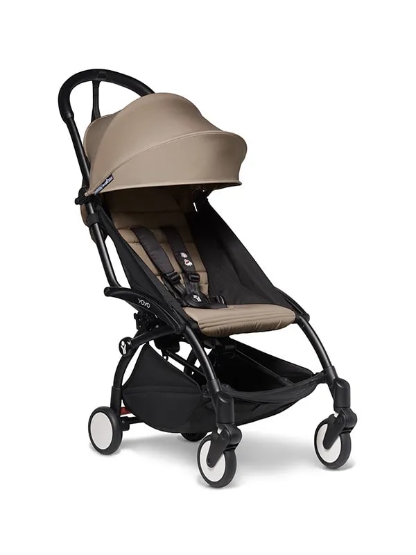 A stroller with a beige seat and black wheels