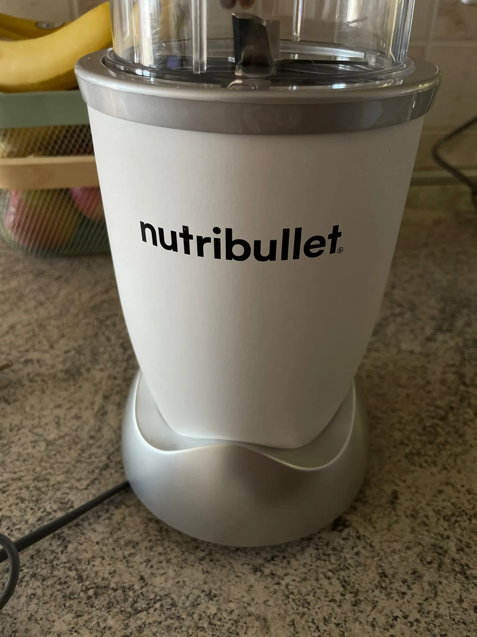 A white blender sitting on top of a counter