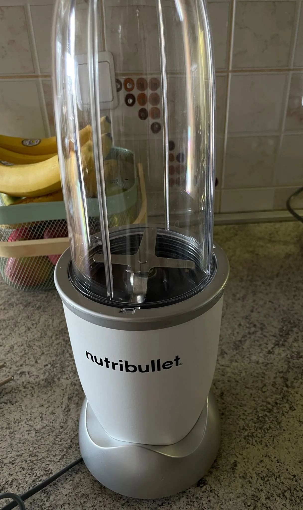 A white blender sitting on top of a counter