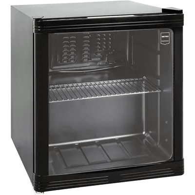 A black and white photo of an empty mini - fridge