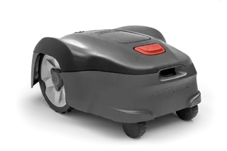 A grey lawn mower on a black background