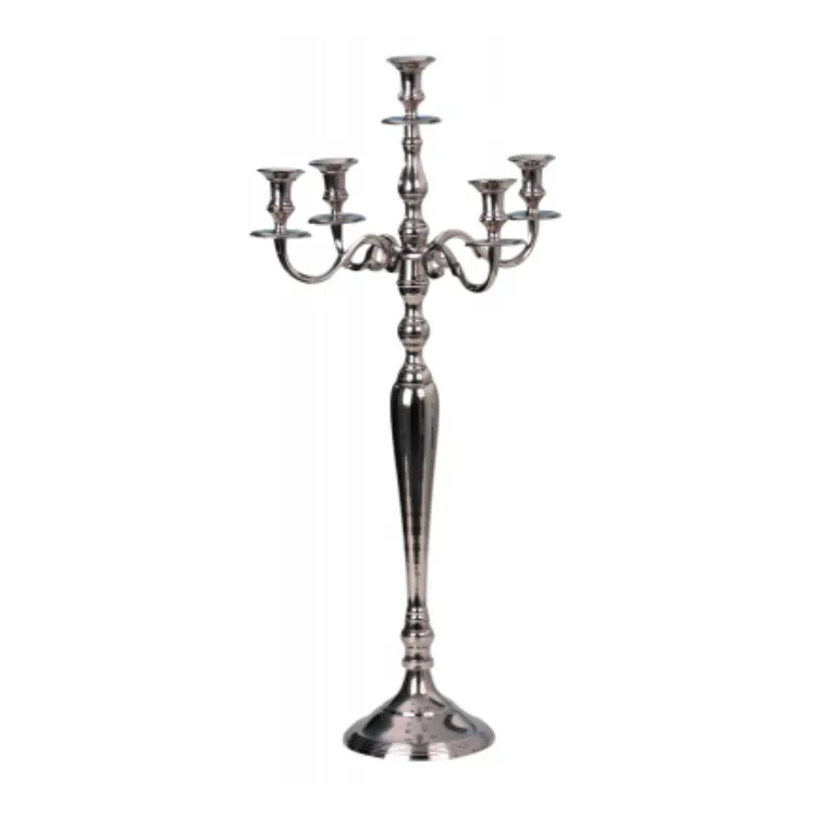 A metal candelabra with four candles on it
