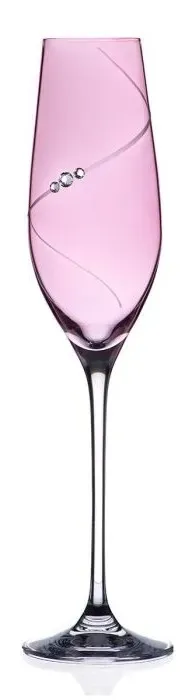 A wine glass with a pink liquid inside of it