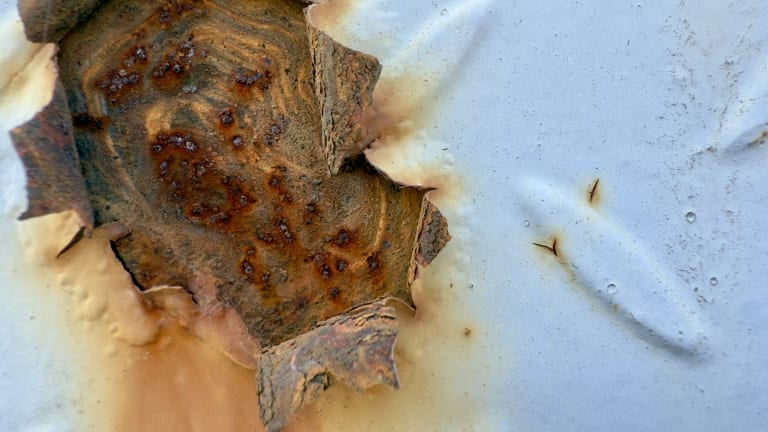 Pitting corrosion on metal pipe