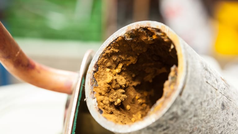 sediment buildup caused by rust