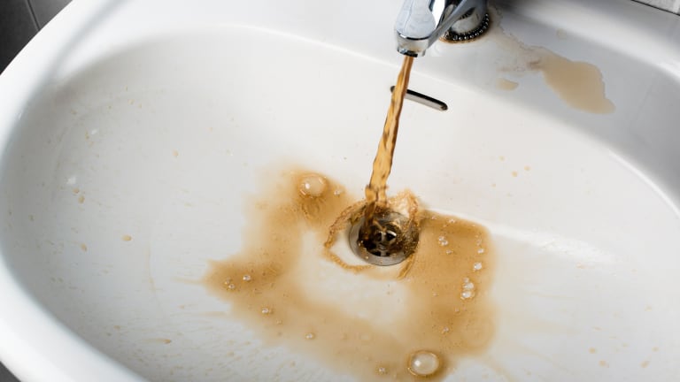 rusty water from old galvanized pipes