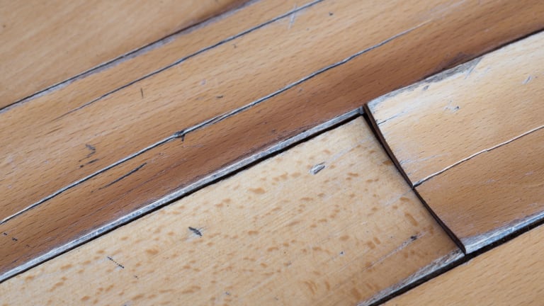 wood flooring damaged by a slab leak