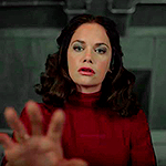 His Dark Materials. Mrs. Coulter extending her hand in front of her, when she hears Lyra's voice from the chamber.