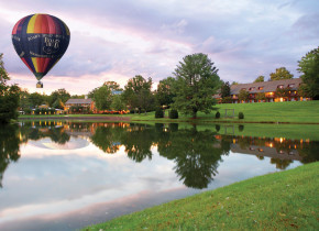 Hot air balloon over lake at The Boar's Head.