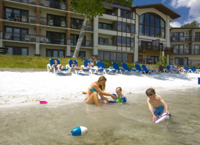 Kids playing at the beach at Golden Arrow Lakeside Resort.