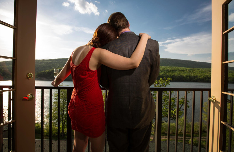 Couple on private balcony at Rocky Gap Casino Resort.