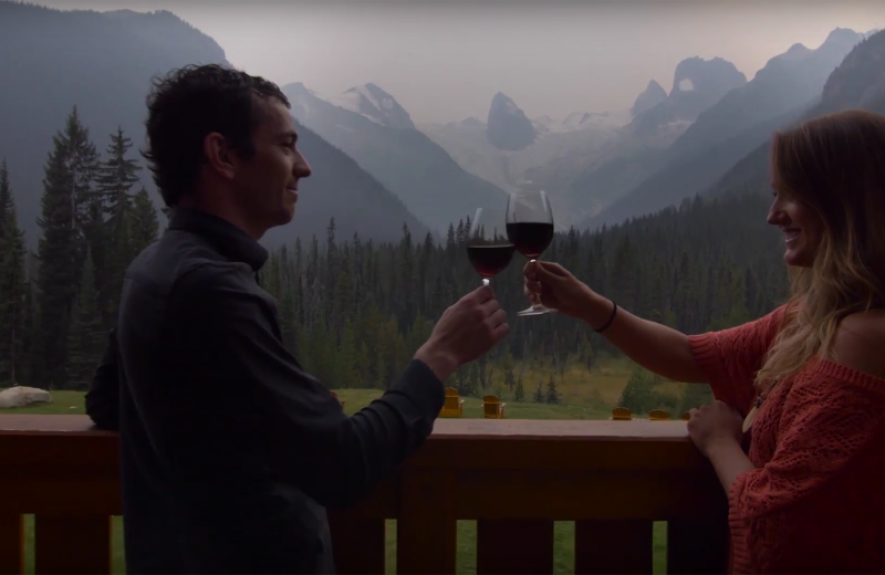 Couple toasting at Bugaboos Lodge.