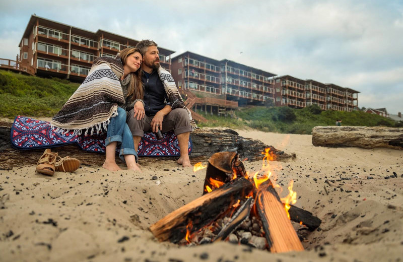 Couple on beach at Hallmark Resort & Spa Cannon Beach.
