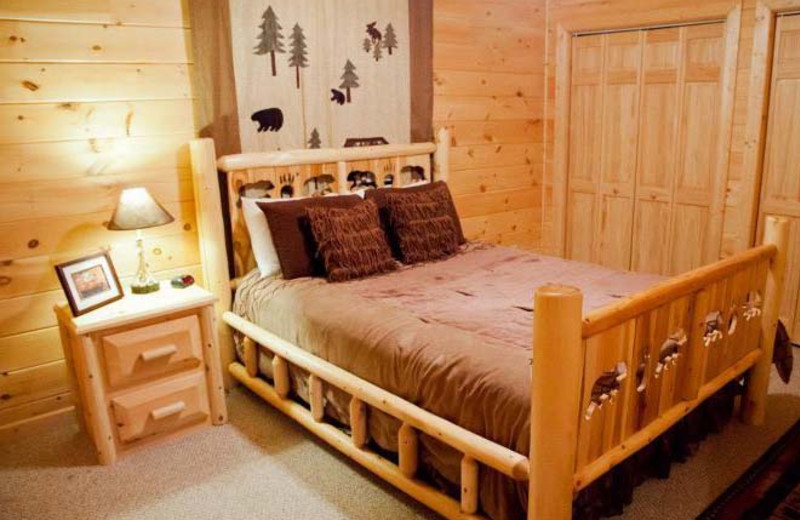 Cabin bedroom at Mountain Getaway Cabin Rentals.