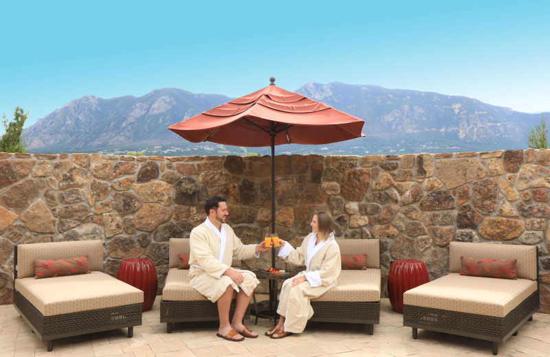 Private outdoor relaxation patio with mountain views at Alluvia Spa & Wellness Retreat, Cheyenne Mountain Resort's on-site spa.