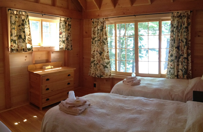 Cabin bedroom at Rockywold-Deephaven Camps.