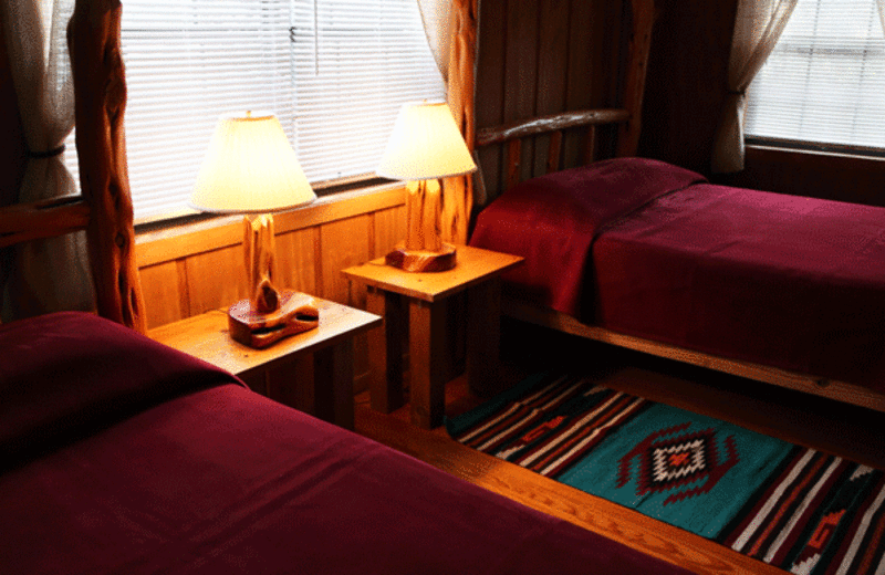 Cabin bedroom at West 1077 Guest Ranch.